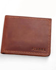 A brown leather bifold wallet with visible stitching and the brand name 'PIKORE' embossed in the bottom right corner, shown on a plain white background.