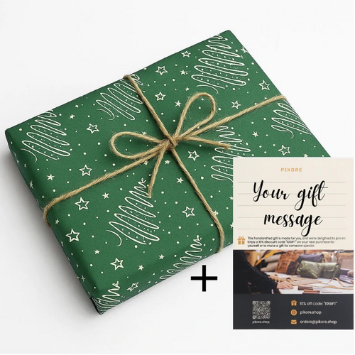 Green gift wrap with white patterns and a brown ribbon, accompanied by a gift message card on a white background.