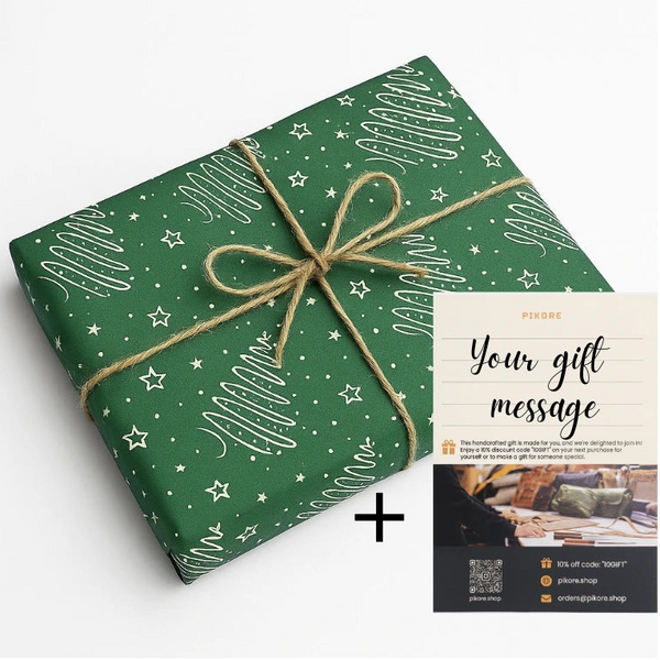 Green gift wrap with white patterns and a brown ribbon, accompanied by a gift message card on a white background.