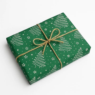 Green gift box with white tree pattern and string bow on a white background