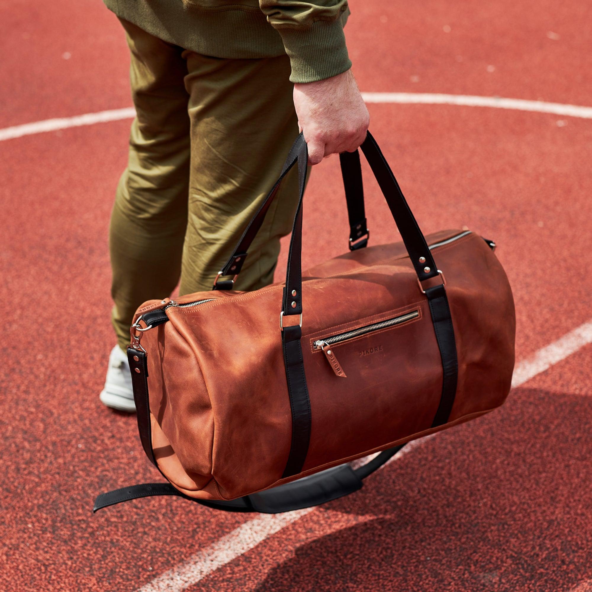 Tan leather outlet duffle bag