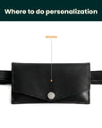 Black belt bag with a button on a white background, indicating where to do personalization.
