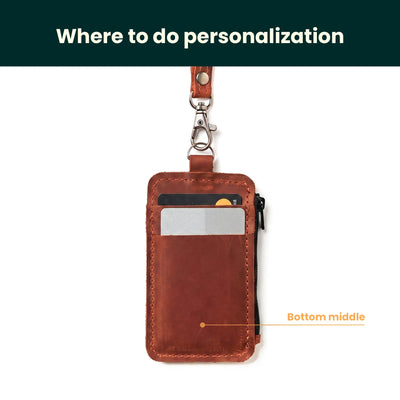 Brown leather wallet with a lanyard on a white background, showing personalized area.