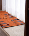 Backgammon board with pieces and dice on a wooden surface