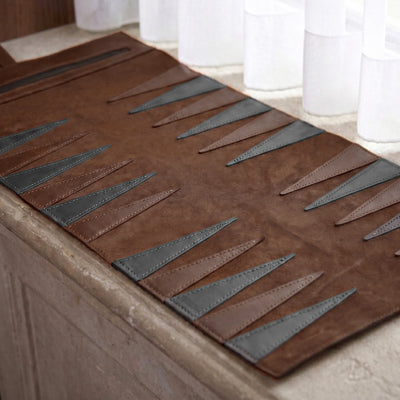 Brown and gray patterned rug on a wooden floor