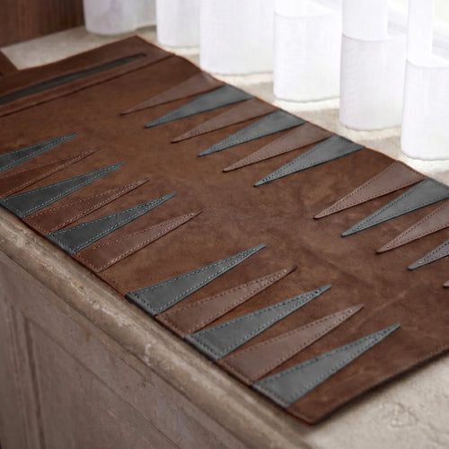 Brown and gray patterned rug on a wooden floor