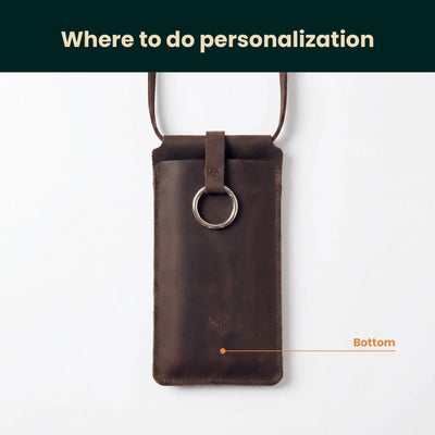 Brown leather phone pouch with a ring on a white background, indicating where to do personalization.