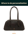 Brown handbag on a white background with text indicating where to do personalization.